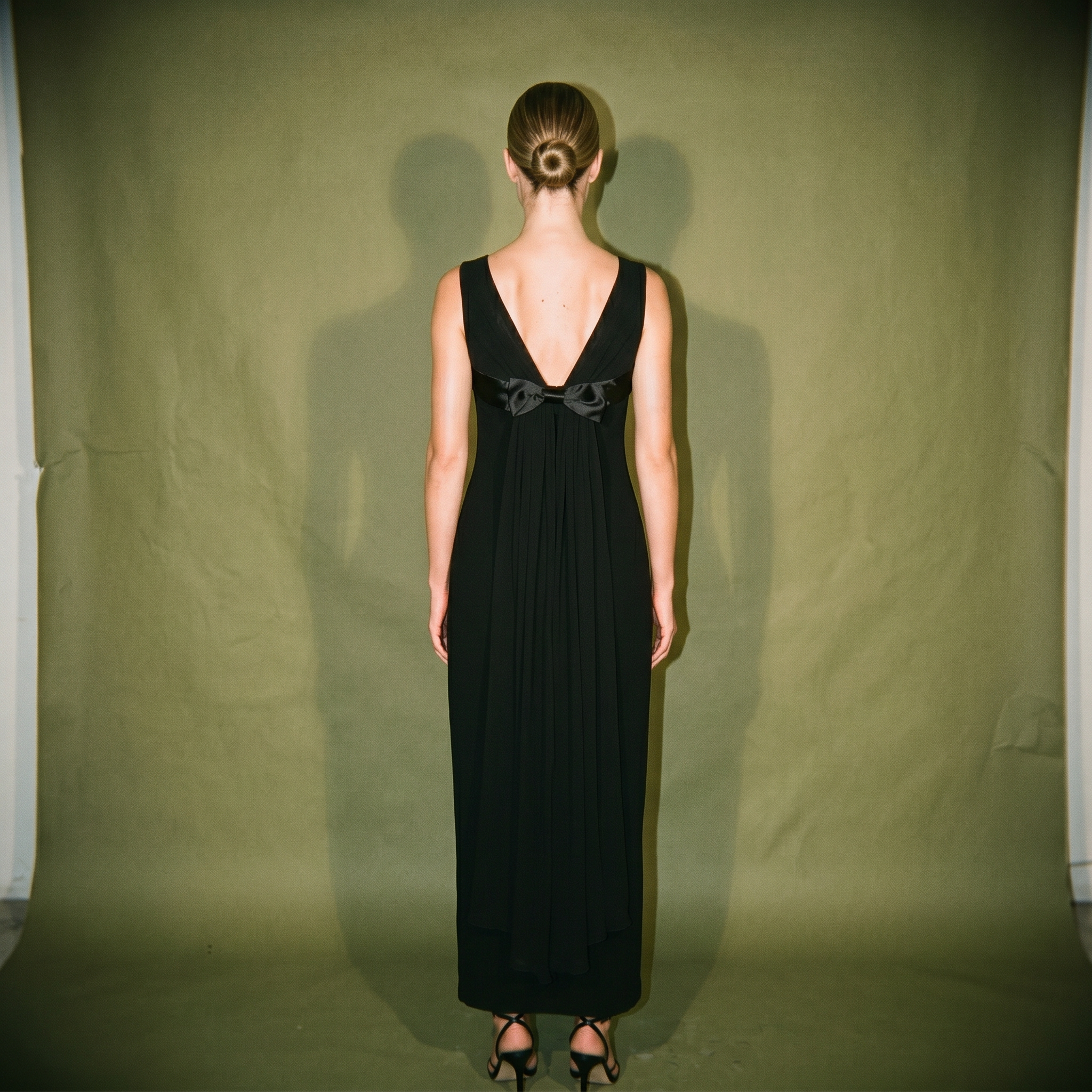 Cignal Black Dress Sleeveless Sheer Neckline Bow at the Bust Slit